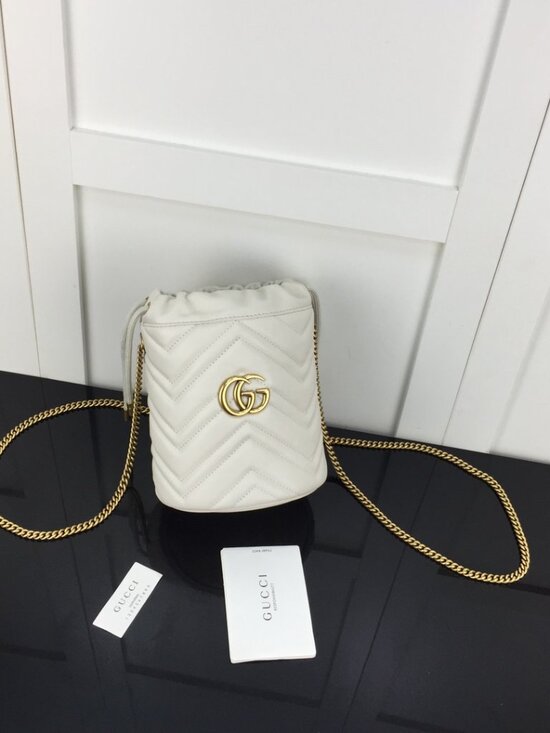 Gucci Handbags - Gucci Cream Crossbody Bag with Gold Accents